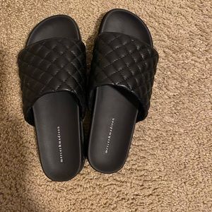 Black quilted slip on